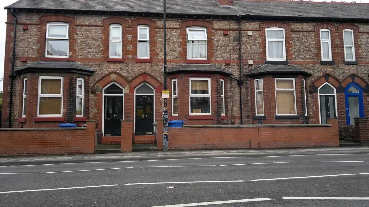 Victorian red-brick terraced houses with bay windows on Manchester Road, Altrincham