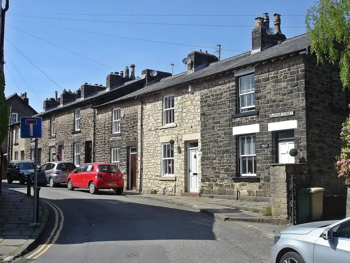 Row of stone terraced houses on Playfair Street, Bolton