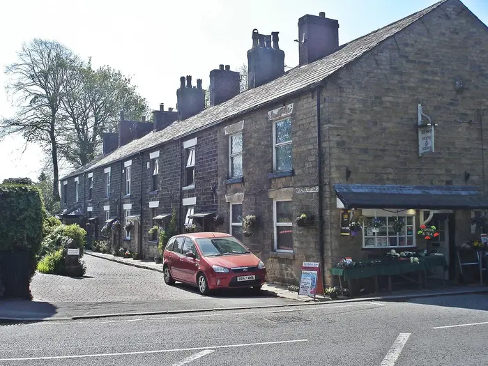 Stone terraced cottages with slate roofs and chimneys at Whitehill Cottages, Bolton