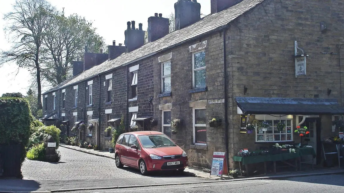 Stone terraced cottages with slate roofs and chimneys at Whitehill Cottages, Bolton