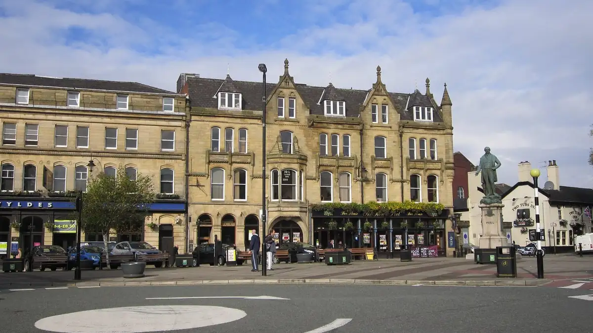 Market Place in Bury town centre with the Robert Peel statue and Victorian stone buildings