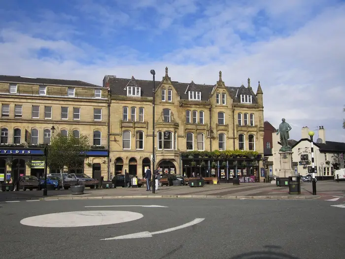 Market Place in Bury town centre with the Robert Peel statue and Victorian stone buildings