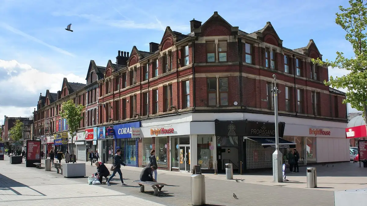 Victorian red-brick shops on The Rock, the main shopping street in Bury