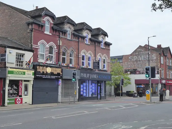Shops at the junction of Wilmslow Road and School Lane, Didsbury village