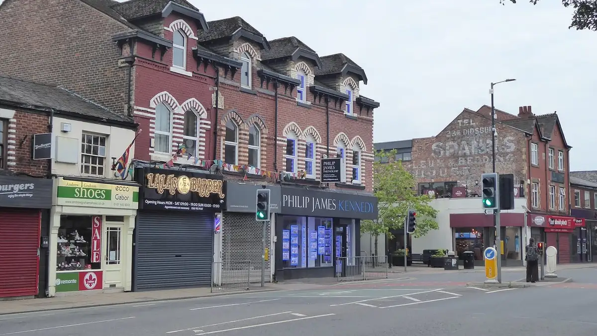 Shops at the junction of Wilmslow Road and School Lane, Didsbury village