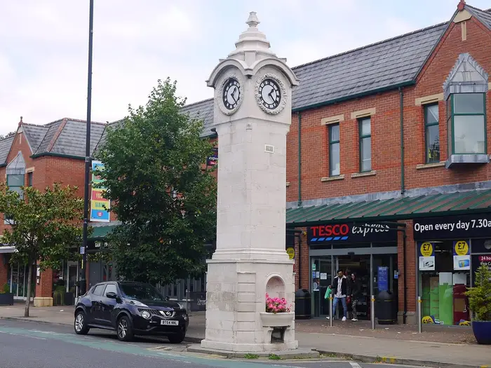 Rhodes Memorial Clock Tower and shops on Wilmslow Road, Didsbury village