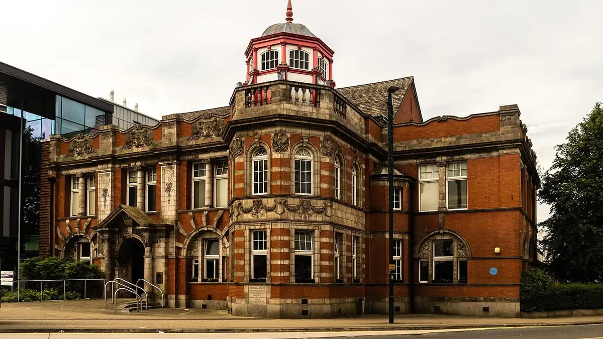 Ornate red-brick and terracotta building with a cupola in Eccles town centre