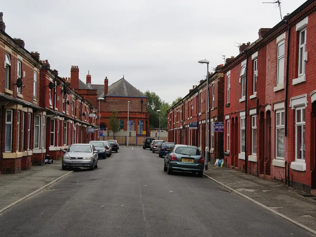 Red-brick Victorian terraced houses along Letchworth Street, Rusholme, Manchester