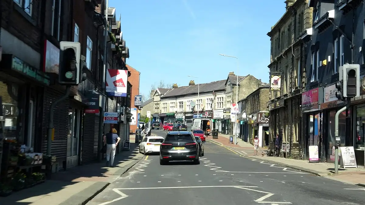Shops and stone buildings along Lee Lane, the main street in Horwich