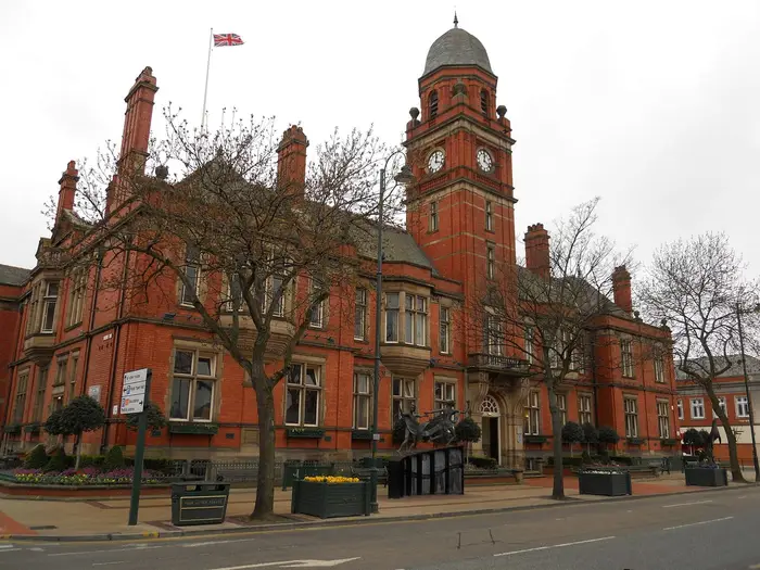 Hyde Town Hall, a red-brick Victorian building with clock tower
