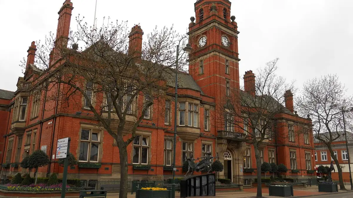Hyde Town Hall, a red-brick Victorian building with clock tower