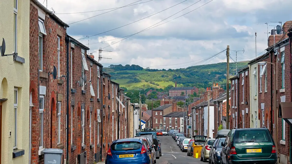 Terraced rooftops on Barton Street, Macclesfield, with hills beyond