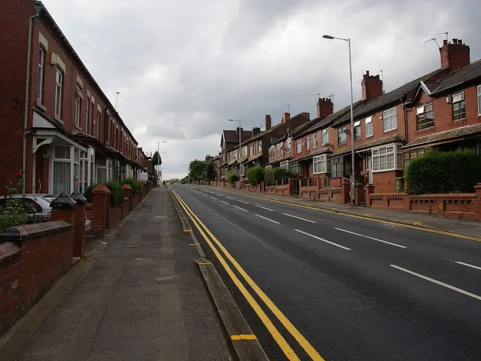 Terraced houses with front gardens on Abbey Hills Road, Oldham