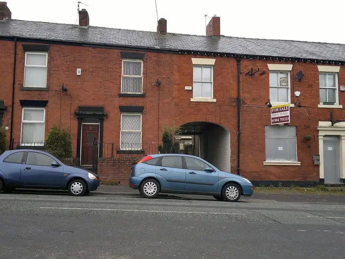 Red-brick terraced houses on Oldham Road, Rochdale
