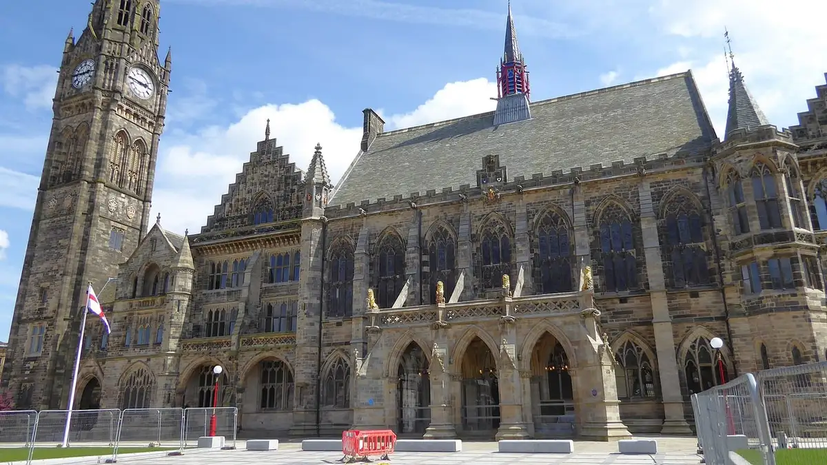 Gothic Rochdale Town Hall and its clock tower under a blue sky