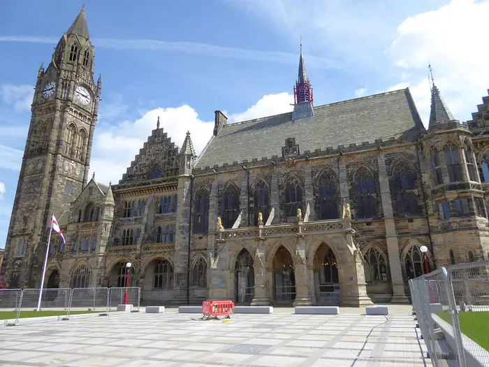 Gothic Rochdale Town Hall and its clock tower under a blue sky