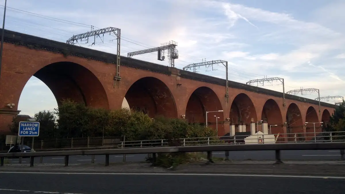 Red-brick arches of Stockport Viaduct carrying the West Coast Main Line over Stockport