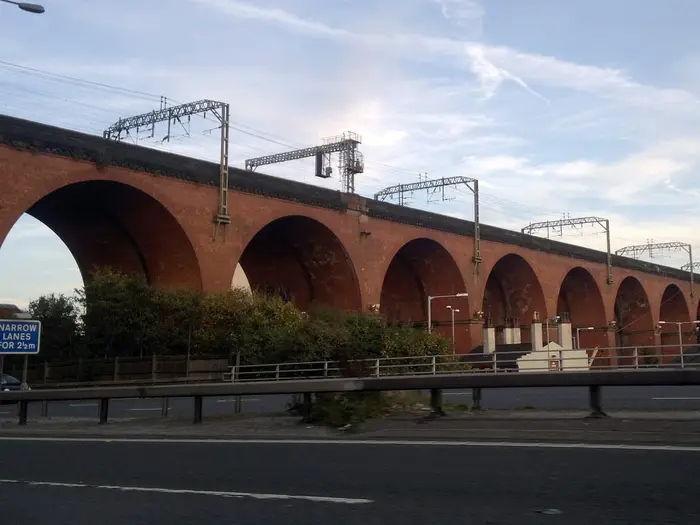 Red-brick arches of Stockport Viaduct carrying the West Coast Main Line over Stockport