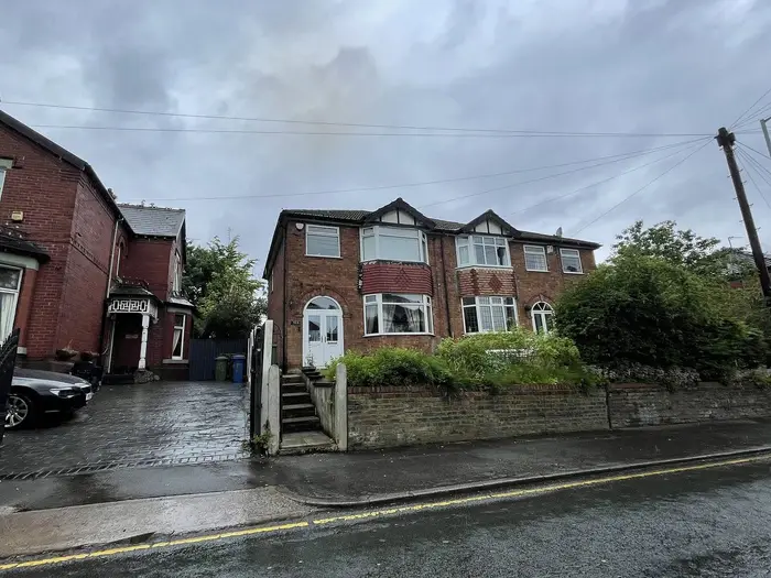 Semi-detached houses with tiled roofs on Hall Street, Offerton, Stockport