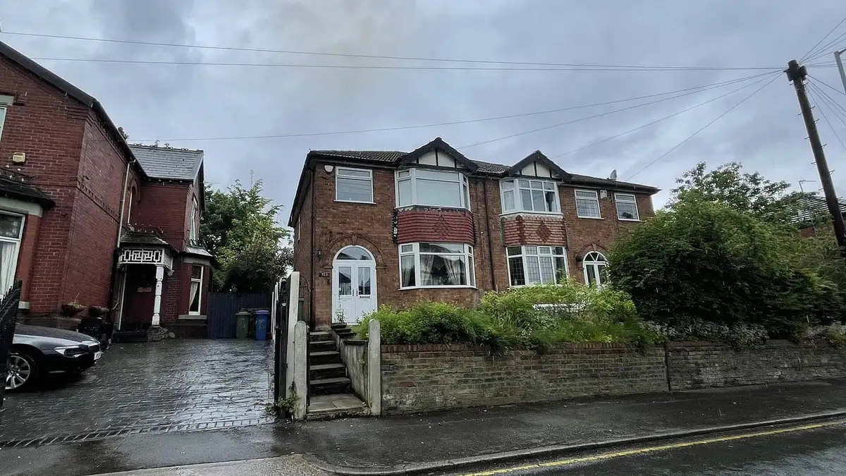 Semi-detached houses with tiled roofs on Hall Street, Offerton, Stockport