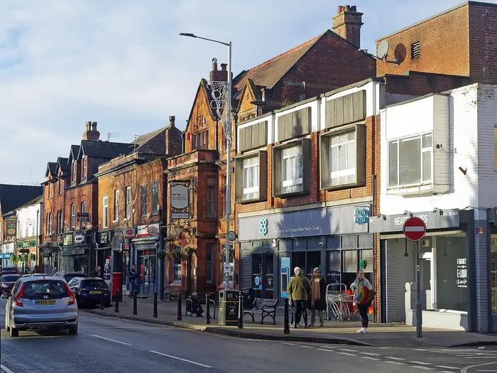 Shops and red-brick buildings on Heaton Moor Road, Heaton Moor, Stockport