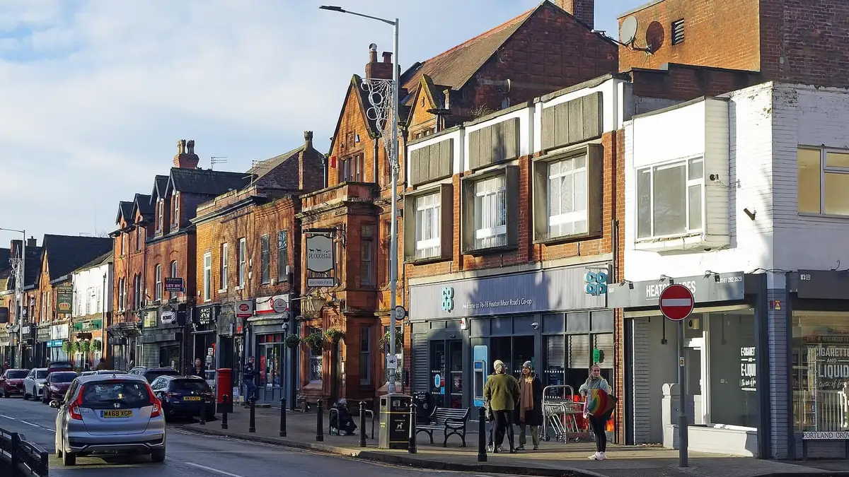 Shops and red-brick buildings on Heaton Moor Road, Heaton Moor, Stockport