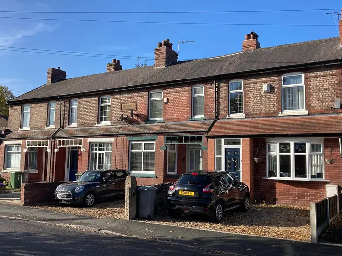 Brick terraced houses of Ringmore on Brook Road, Urmston