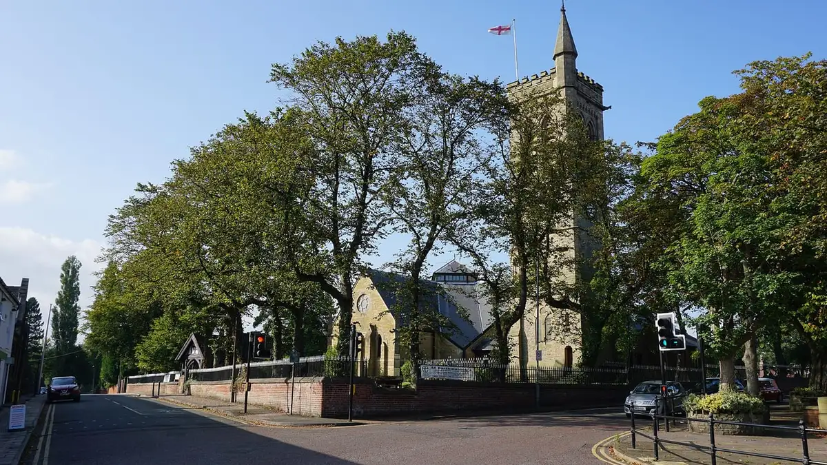St Bartholomew's Church tower among trees in Westhoughton