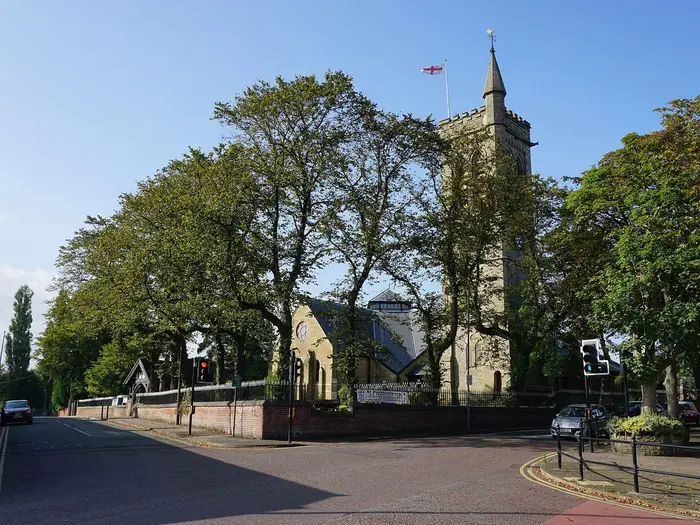 St Bartholomew's Church tower among trees in Westhoughton