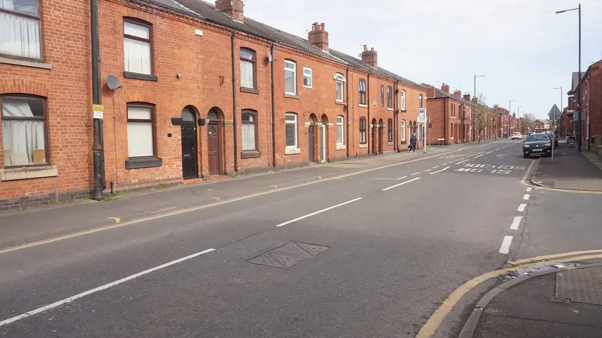 Red-brick terraced houses on Darlington Street East, Wigan