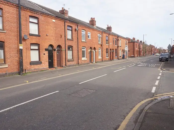 Red-brick terraced houses on Darlington Street East, Wigan