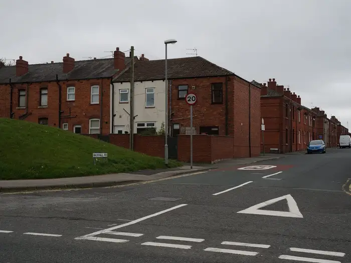 Terraced houses and chimneyed rooftops on Vauxhall Road, Wigan