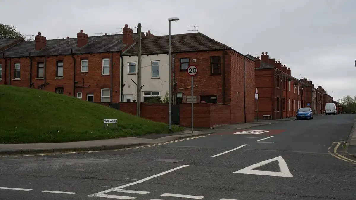 Terraced houses and chimneyed rooftops on Vauxhall Road, Wigan