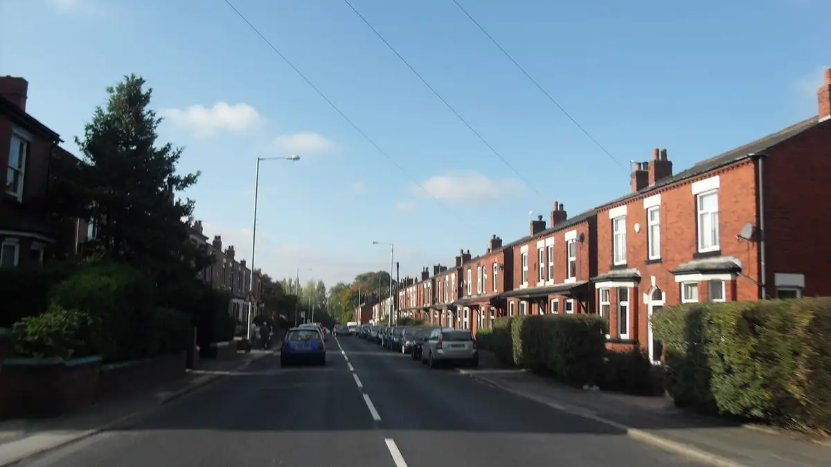 Red-brick terraced houses along Hyde Road, Woodley, near Stockport