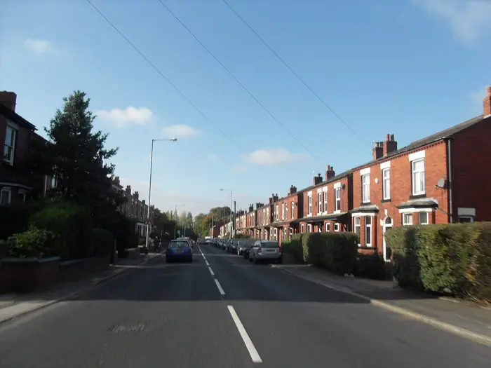 Red-brick terraced houses along Hyde Road, Woodley, near Stockport